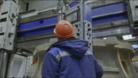 factory worker operating heavy machinery