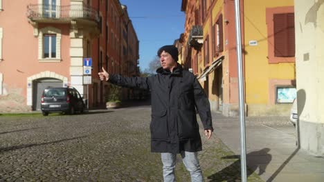 Man Hailing a Cab in European City