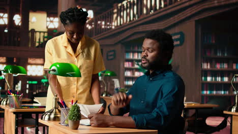 students team read through an academic project in a classic library