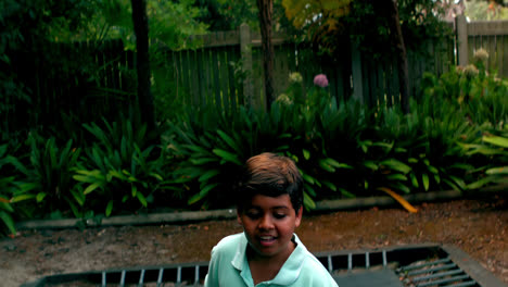 boy jumping up and down on bouncing trampoline
