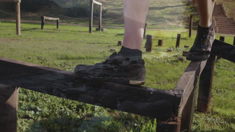 balancing on wooden beam, person in outdoor obstacle course with animation elements