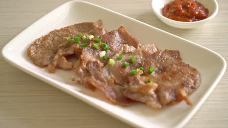 grilled pork neck sliced on plate in asian style