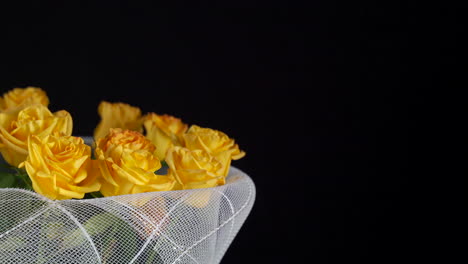 Yellow-roses-slider-panning-flower-arrangement-net-black-background