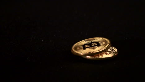 bitcoin coins on black surface