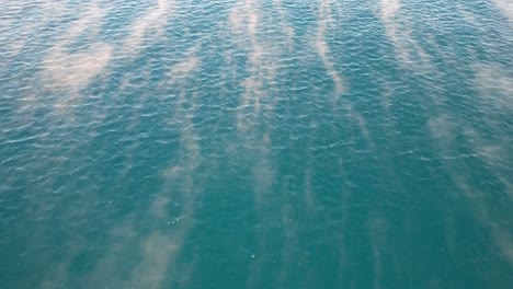 aerial view of sea fog in the ocean during sunrise in coolum beach, sunshine coast, queensland, australia