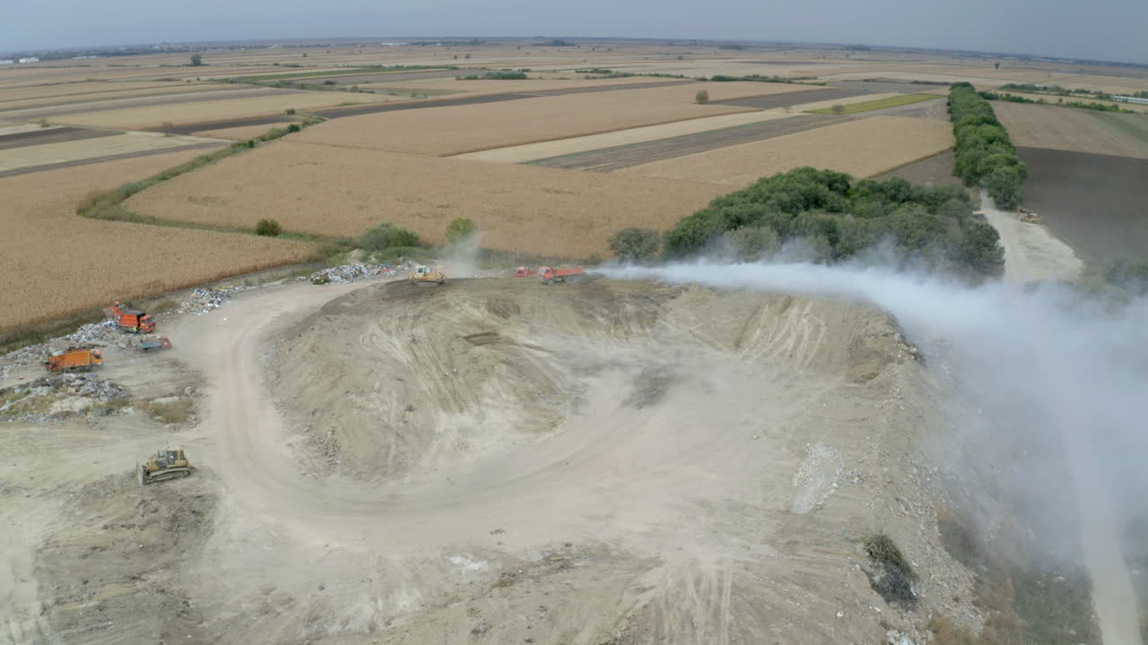 Aerial view of a landfill with waste management machinery