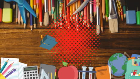 animación de los iconos de los artículos escolares que se mueven sobre el escritorio
