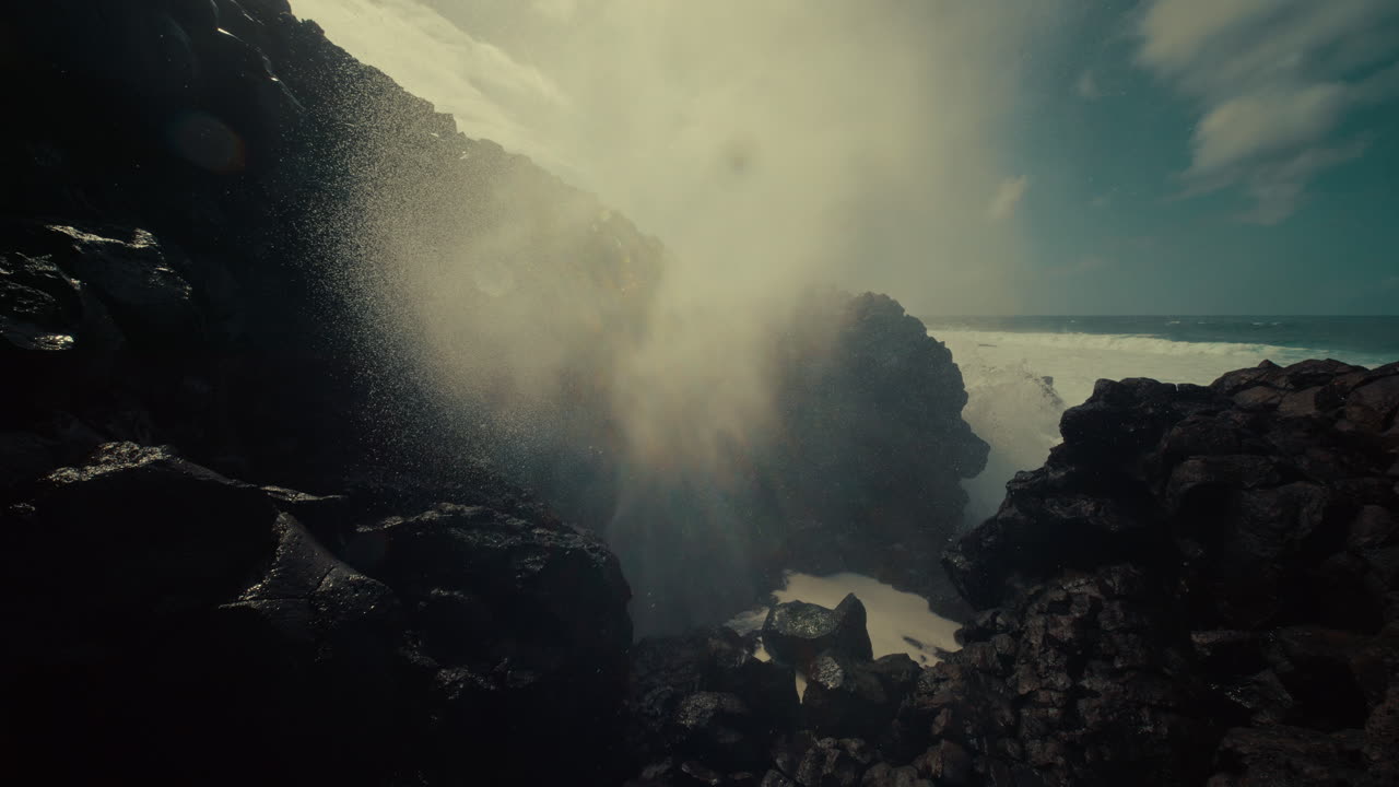 Powerful Ocean Waves Crashing Against Volcanic Rocks