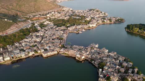 village and lake in shuanglang, yunnan, china.