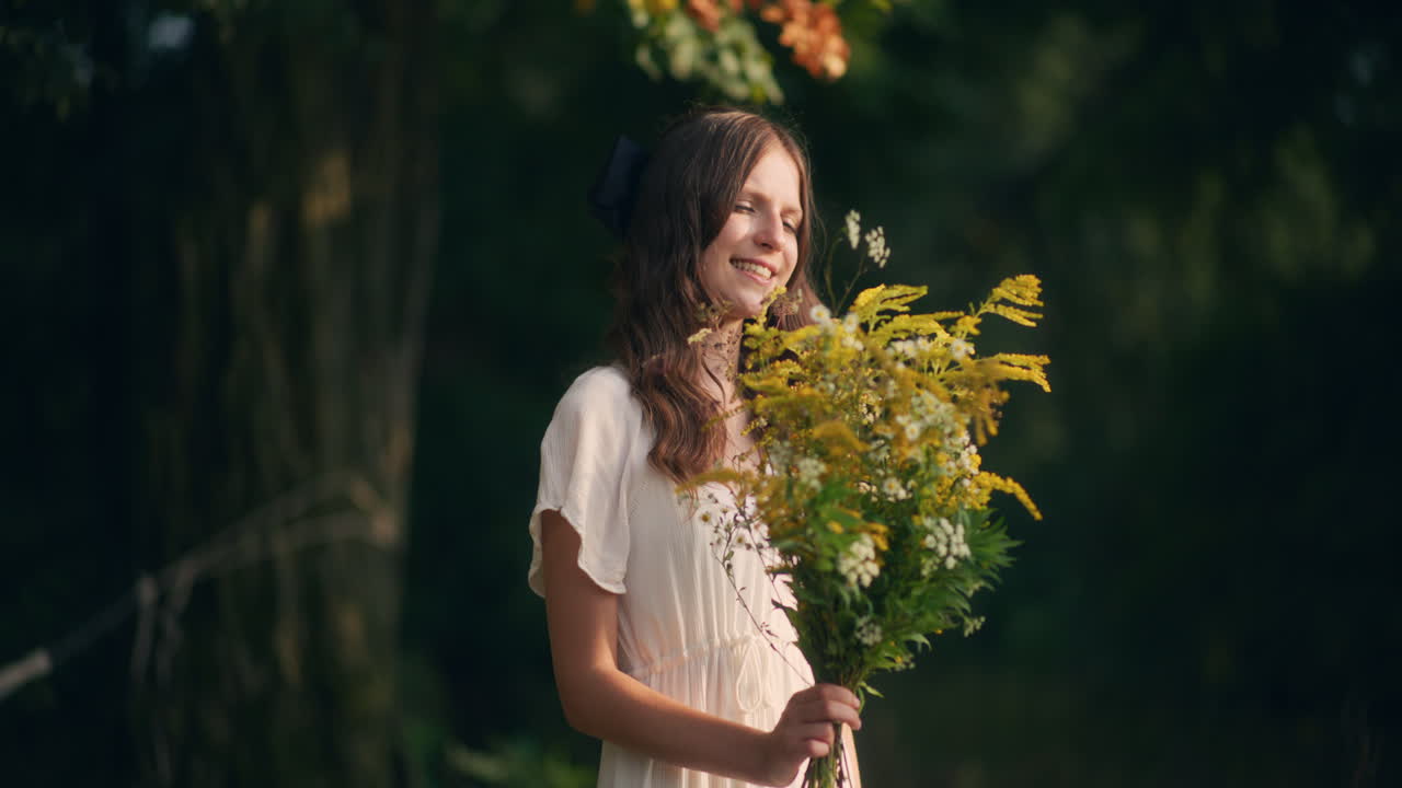 Positive girl with yellow wildflowers