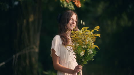 positive girl with yellow wildflowers