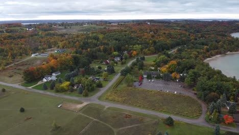 aerial shot of town by the water in the fall