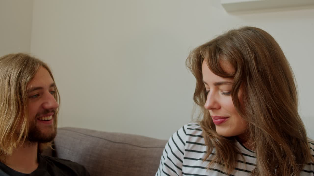 Happy Woman And Man Couple Playfully Feeding Each Other Grape Fruits. Close-up Shot