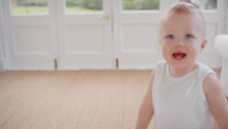 funny baby playing hiding behind curtains happy toddler having fun game of hide and seek enjoying childhood fun at home 4k