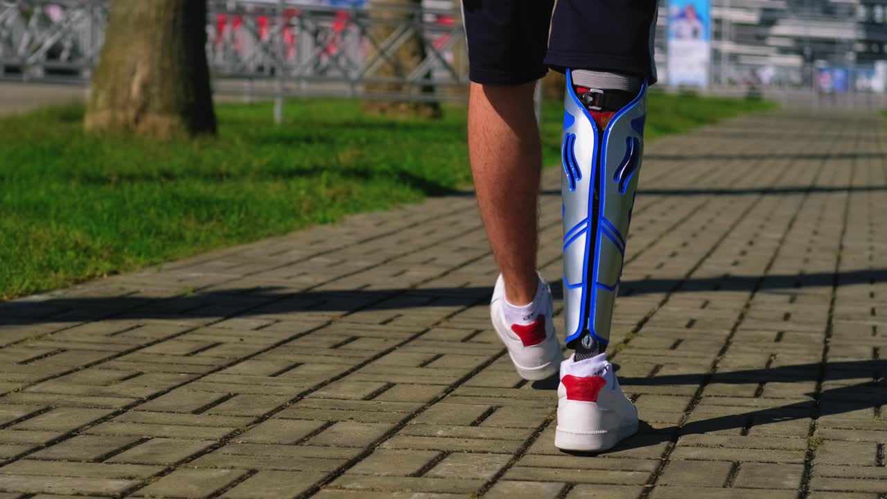 Person with Prosthetic Leg Walking in a Park