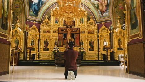 man praying indoors