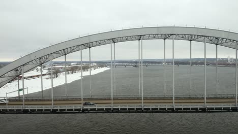 Aerial-Tracking-Shot-of-a-Car-Crossing-the-Centennial-Bridge-Connecting-the-Quad-Cities-in-Illinois-and-Iowa