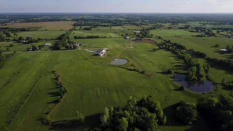 flying over green fields in the midwest