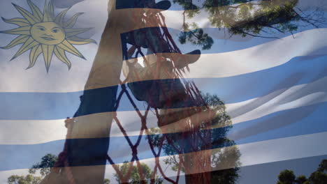 animation of flag of argentina over diverse woman and man during obstacle race training