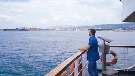 young man watching the sea in slow motion.