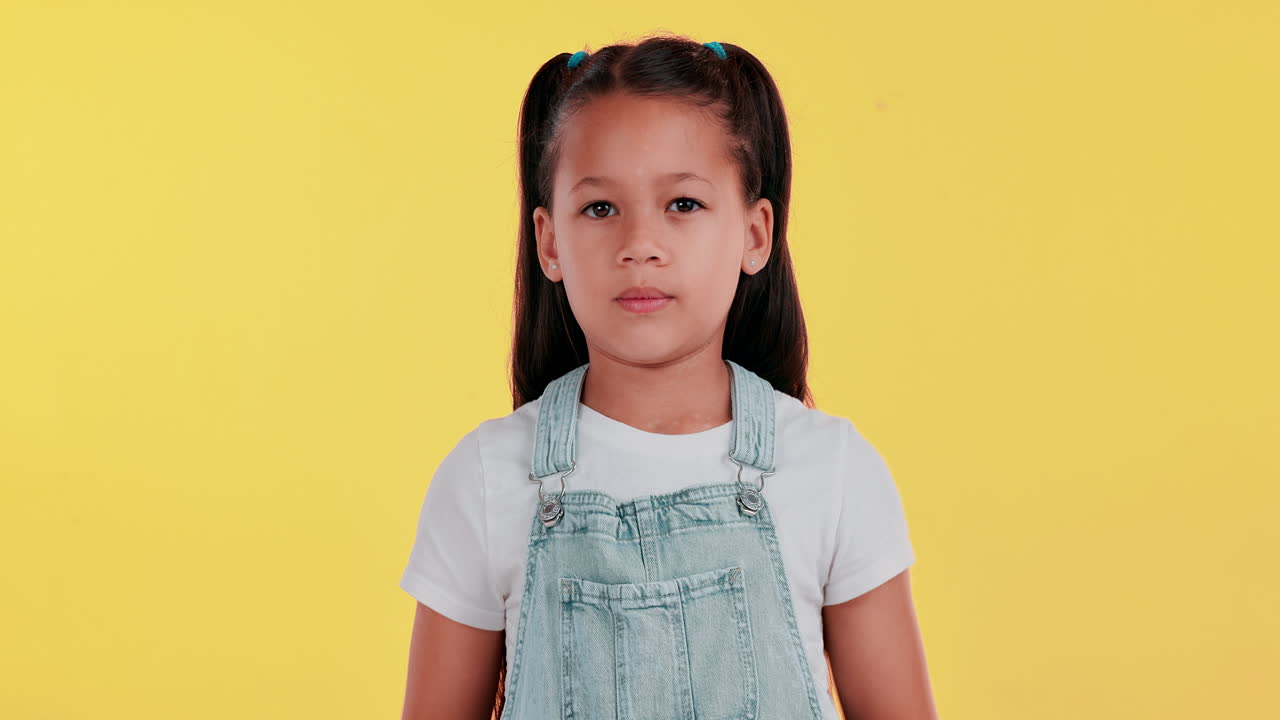 Upset little girl with a pouting expression