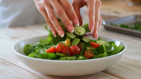 hands preparing a fresh healthy salad