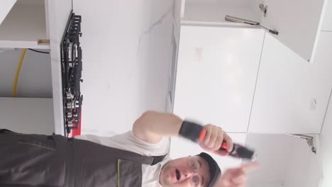 insanely cheerful kitchen furniture installer dances with work tools insanely cheerful kitchen furniture installer dances with work tools happy employee at work