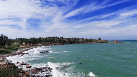 Aerial View Dolly of the Windy Beach and the Rocks in Lam Dong