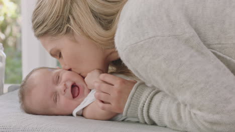 happy-mother-caring-for-baby-at-home-loving-mom-gently-kissing-toddler-soothing-her-child-enjoying-motherhood
