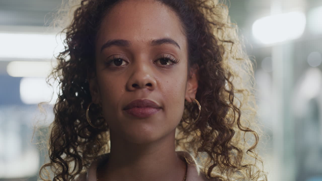 Close-up portrait of a woman with curly hair
