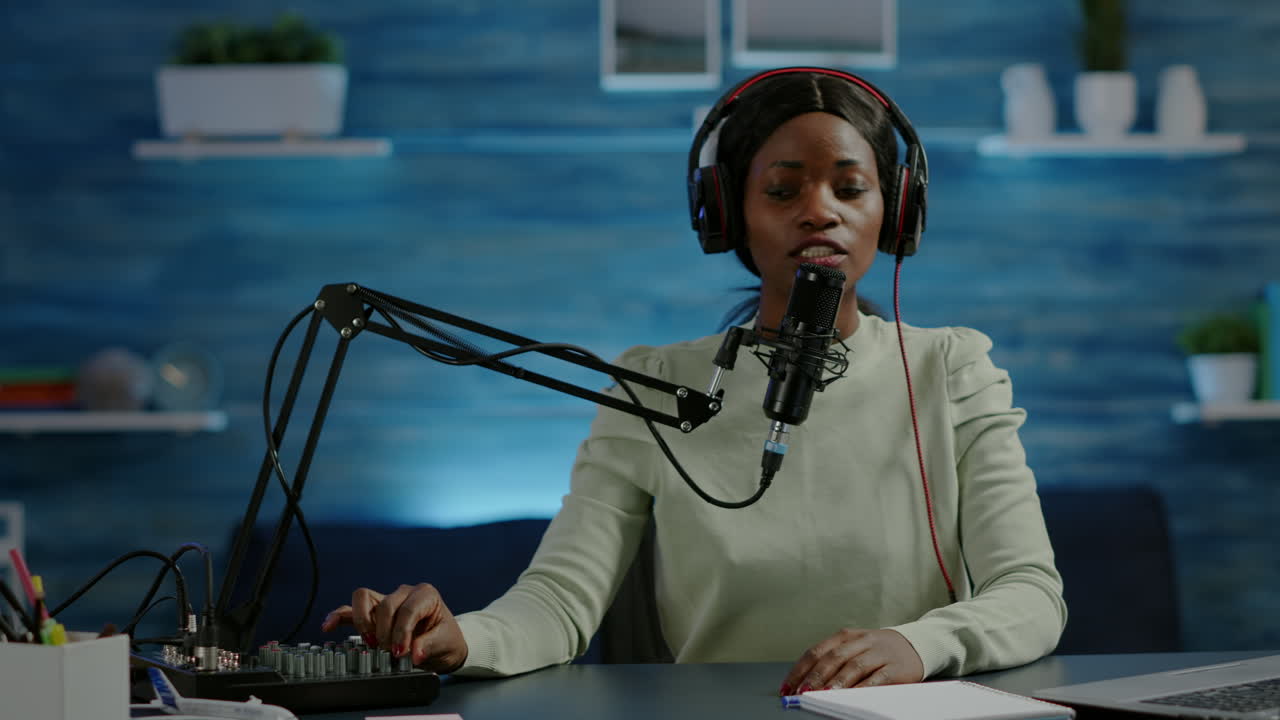 African influencer recording content using professional sound mixer