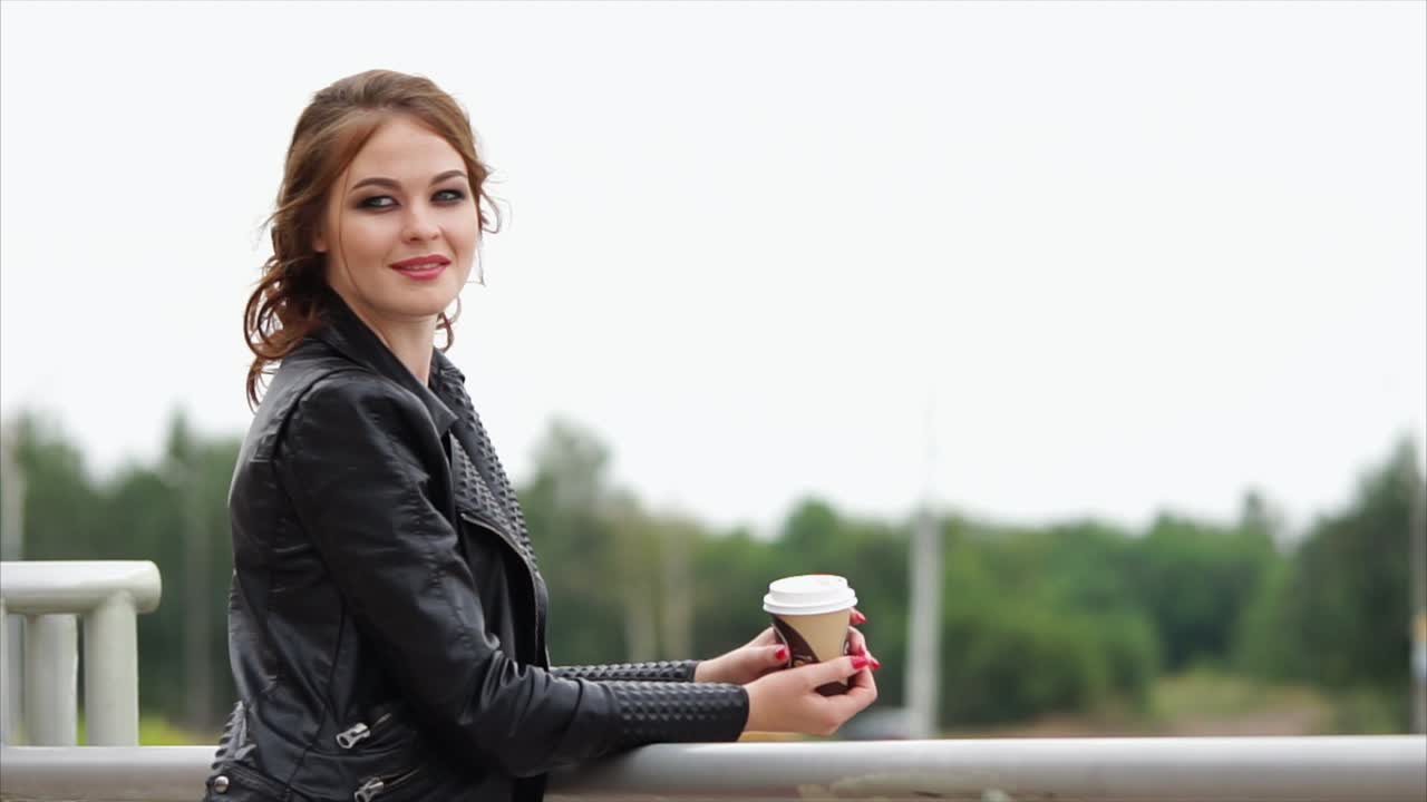 Woman with coffee outdoors