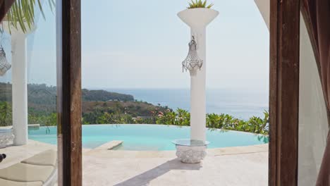 luxury hotel room with infinity pool right outside the door overlooking mountains and ocean