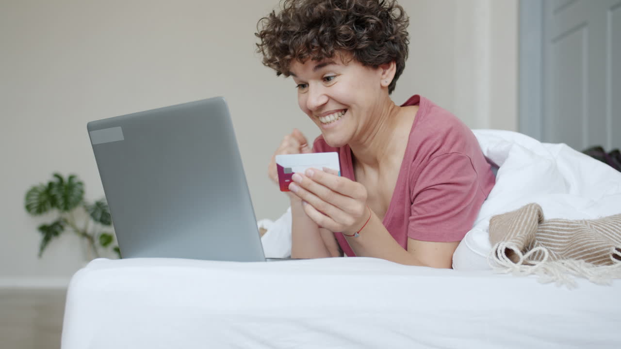 Woman Shopping Online in Bed
