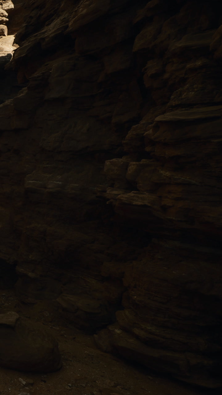 Shadows dancing on rugged canyon walls during the golden hour