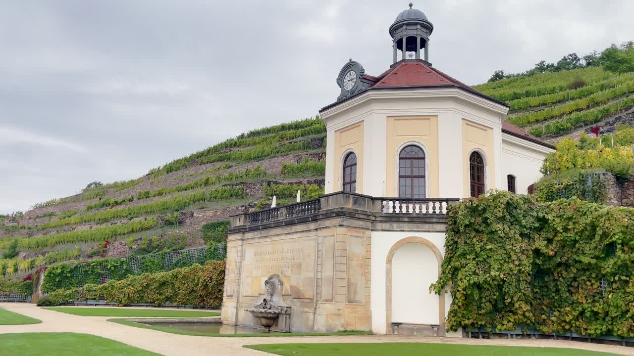 Baroque pavilion at Schloss Wackerbarth surrounded by green vineyards