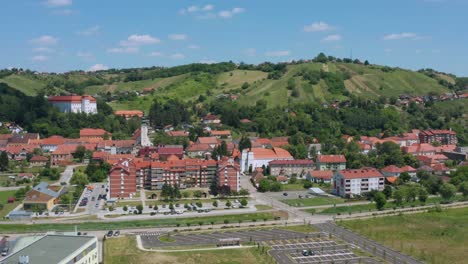 aerial arc shot moving around the center of the town of lendava, slovenia on a bright summer day