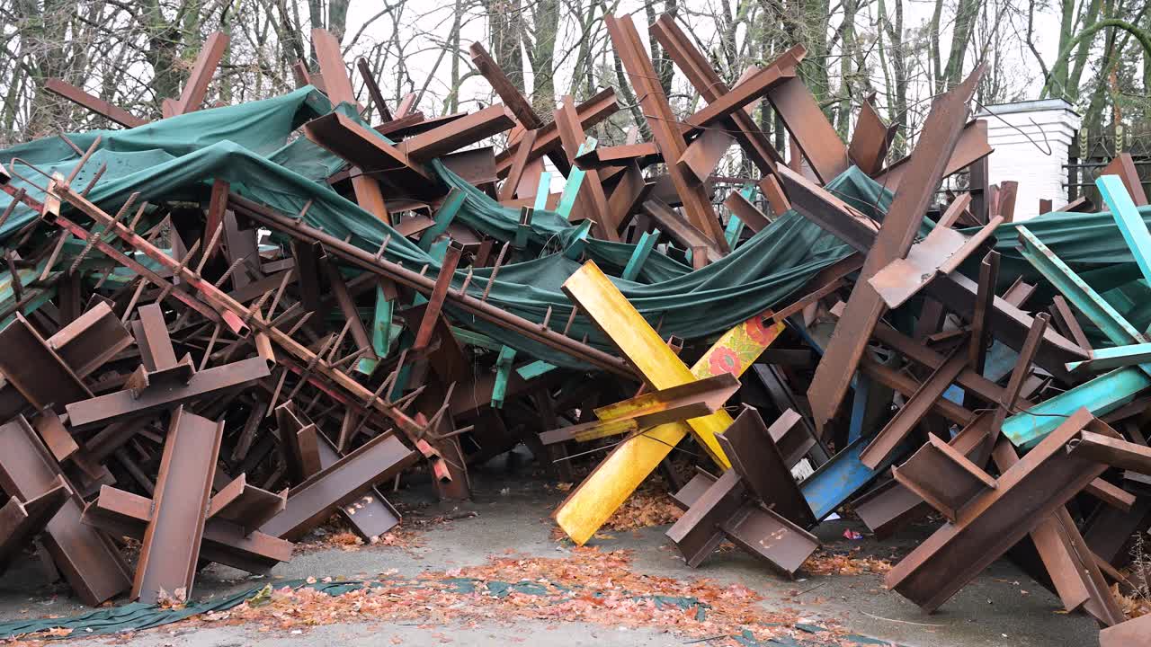 Anti-tank barricades stacked on a street in Kyiv, Ukraine, amid the Ukraine-Russia war, showing the reality of wartime defense.