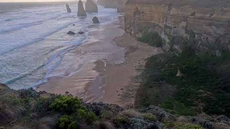 waves crash against iconic limestone formations