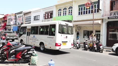 traffic and pedestrians on a bustling city road