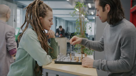 people playing chess in an office