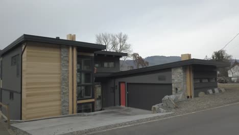 a newly built house overlooking a lake