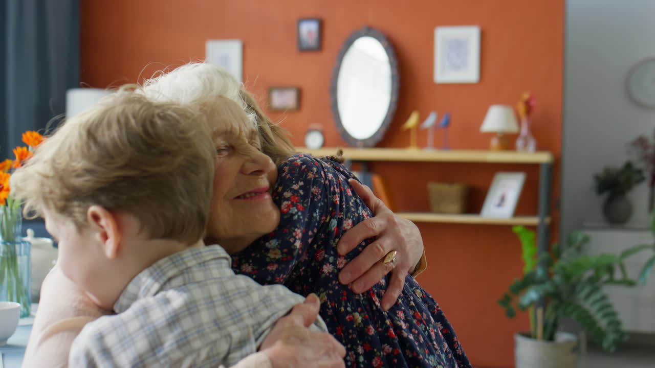 Little Kids Hugging Happy Grandmother at Home