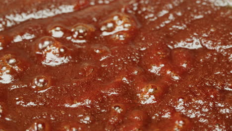 close-up of boiling brown sauce
