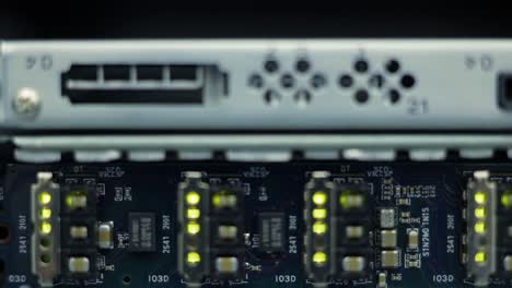 detailed close-up of electronic circuit board components and interfaces in a technology device, highlighting lights and connections for analysis