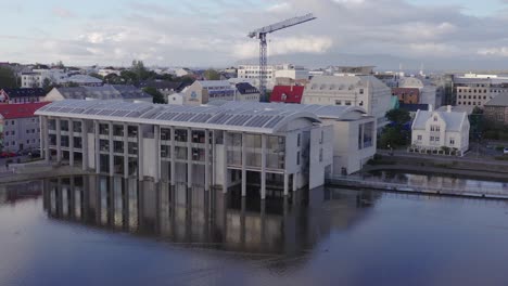 State-of-the-art-city-hall-with-pillars-in-lake,-Capital-of-Iceland,-Reykjavik