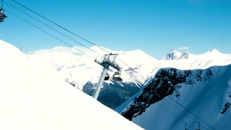 empty chair lifts work in a mountain ski resort in the mountains