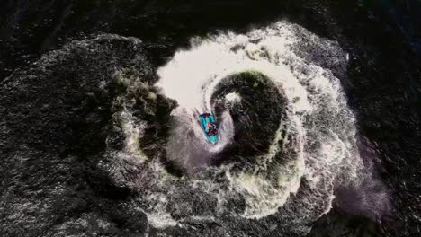 overhead view of a man having fun carving it up on a jetski at spring break