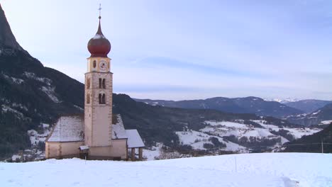 an eastern church in a snowbound tyrolean village in the alps in austria switzerland italy slovenia or an eastern european country