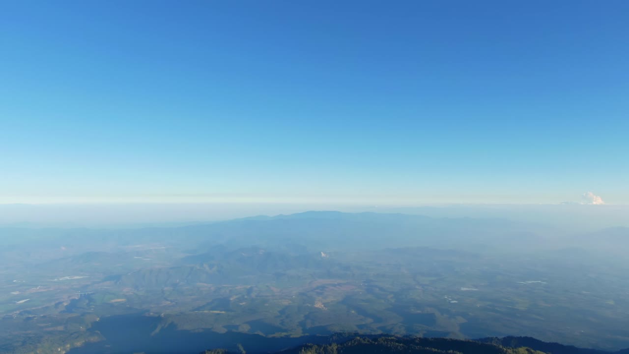 Serene view from Nevado de Colima, Mexico captures vast rugged landscape